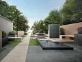 Un elegante giardino con pavimentazione senza cemento, sentiero in pietra, piscina e zona relax.