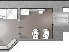 Pianta di un bagno con doccia, lavandino, due WC e un bidet. L'antibagno obbligatorio è ben visibile.