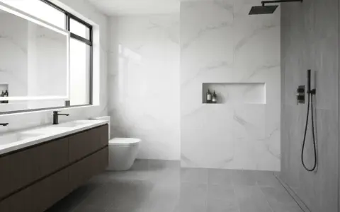 Bagno moderno con doppio lavabo, wc sospeso e doccia a filo pavimento con pendenza per un drenaggio ottimale.