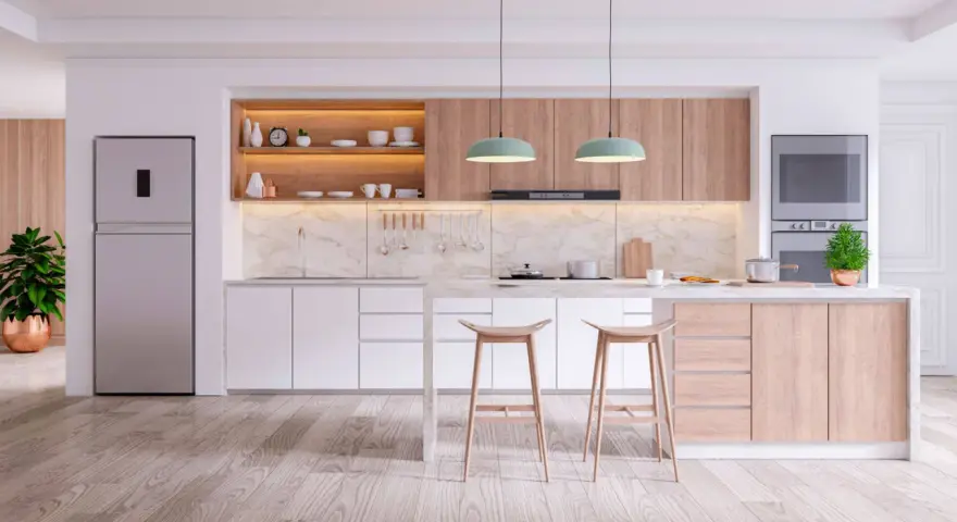 Cucine in cartongesso moderne con isola centrale, elettrodomestici integrati e finiture in legno chiaro.